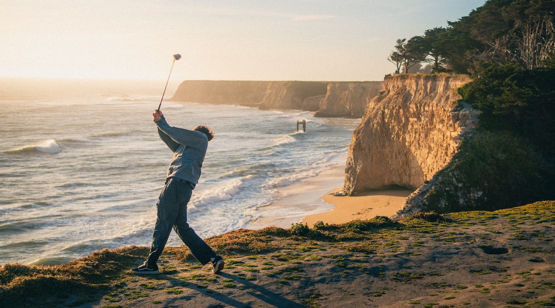 golfer playing on sand