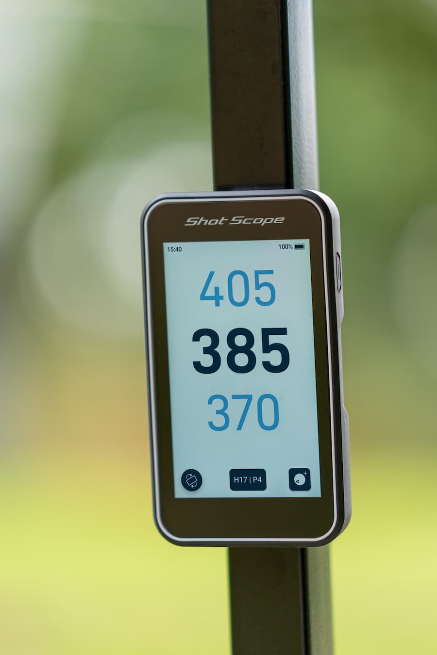 Shot Scope H50 Handheld on the golf course displaying the GPS information to front, middle and back of green