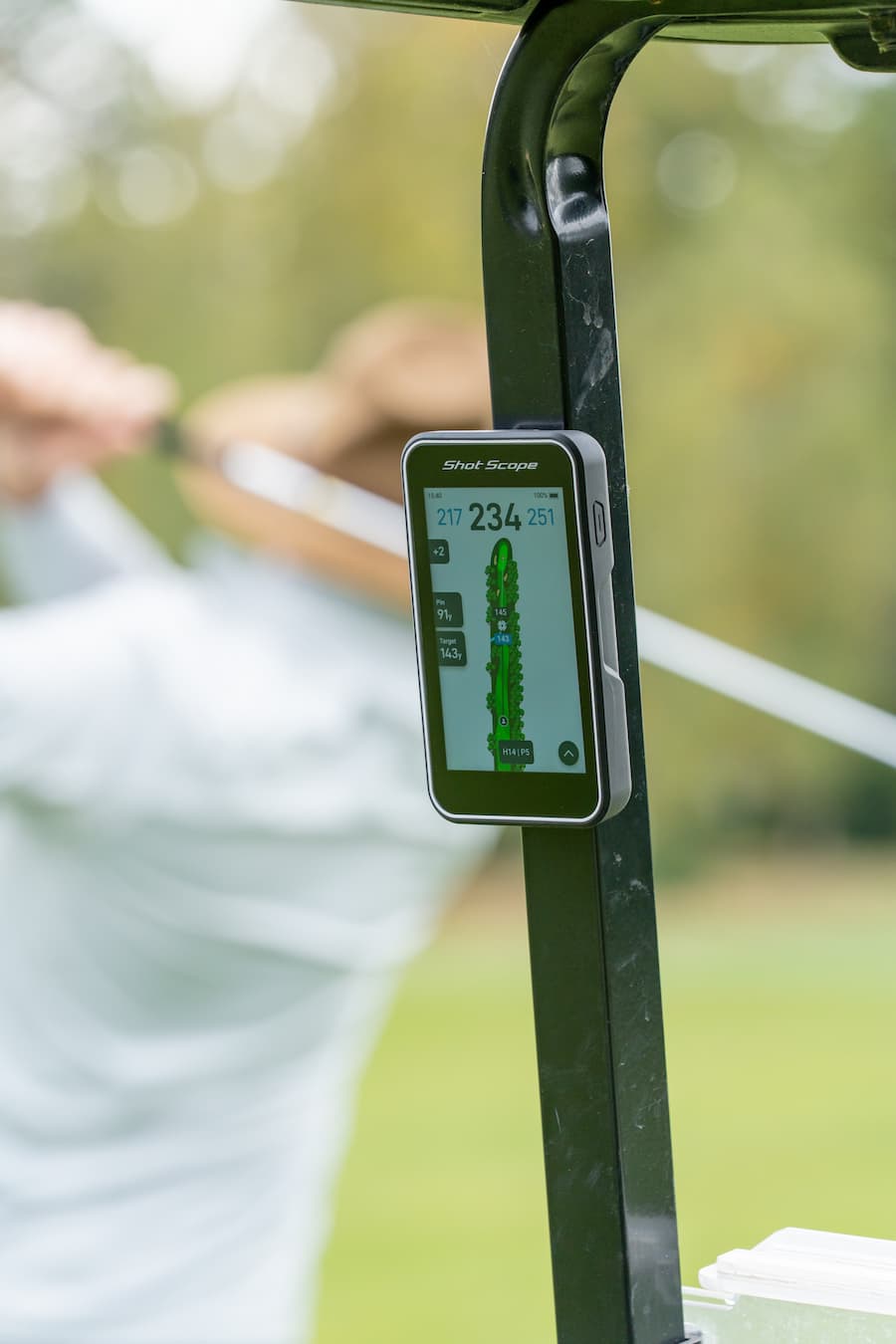 Shot Scope H50 Handheld on the golf course attached to cart using magnet, showing hole overview map