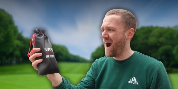 Andy holding the TRS Slider pouch and smiling at it